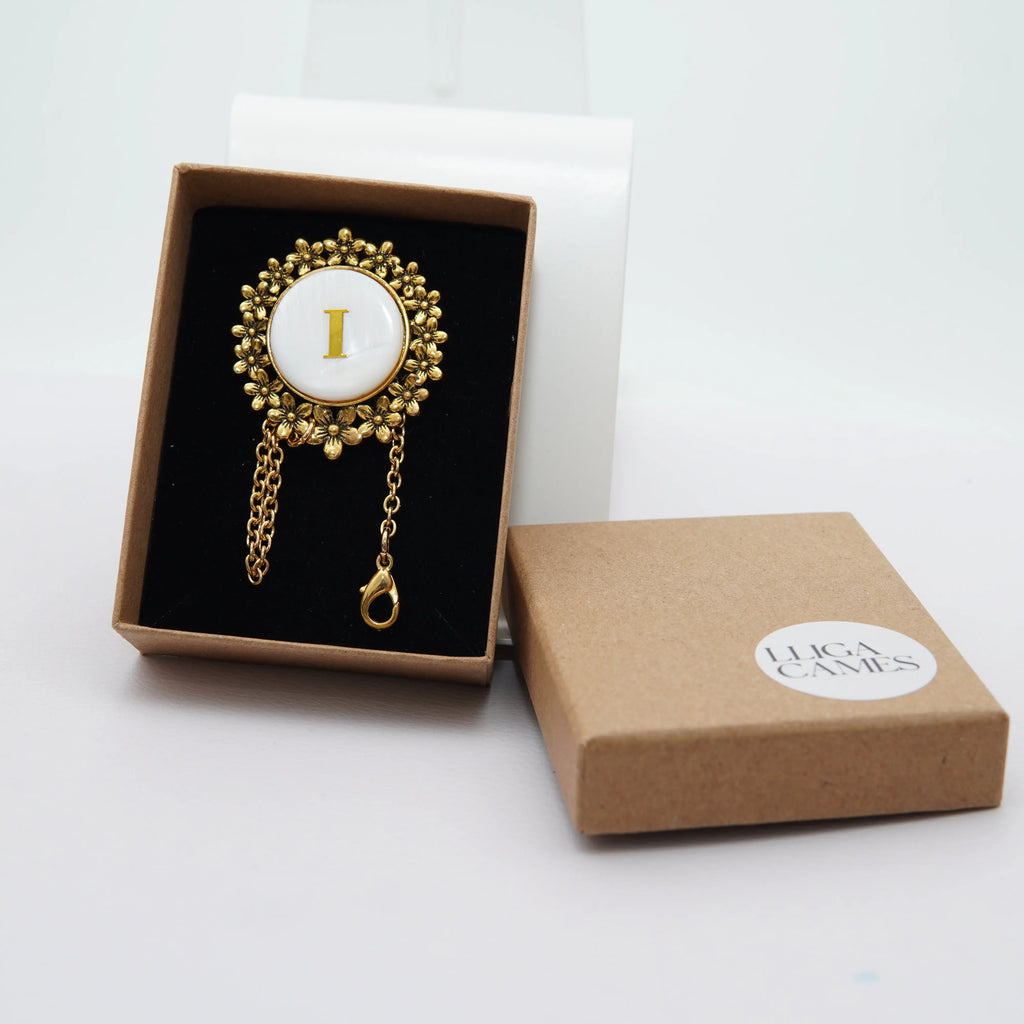 Abaniquero Inicial flor dorada