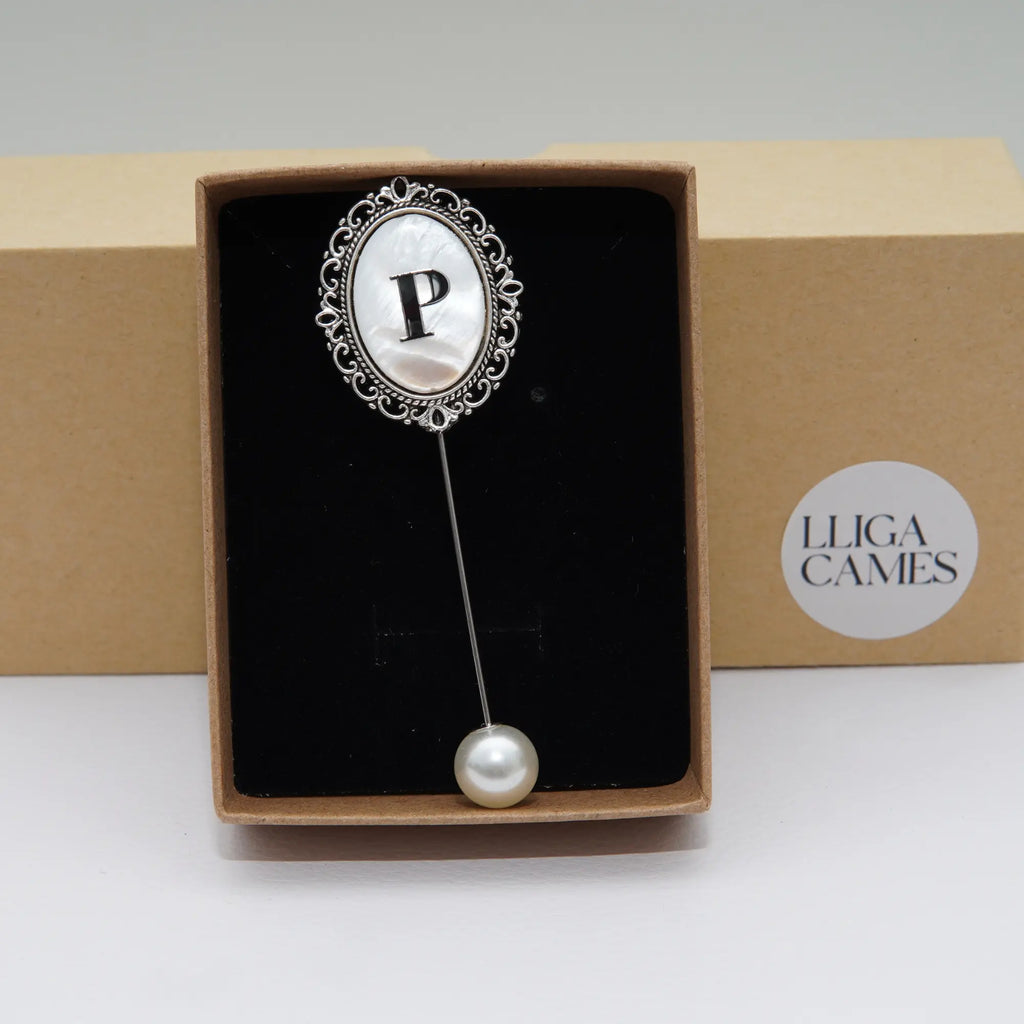 Aguja de banda Inicial plateada