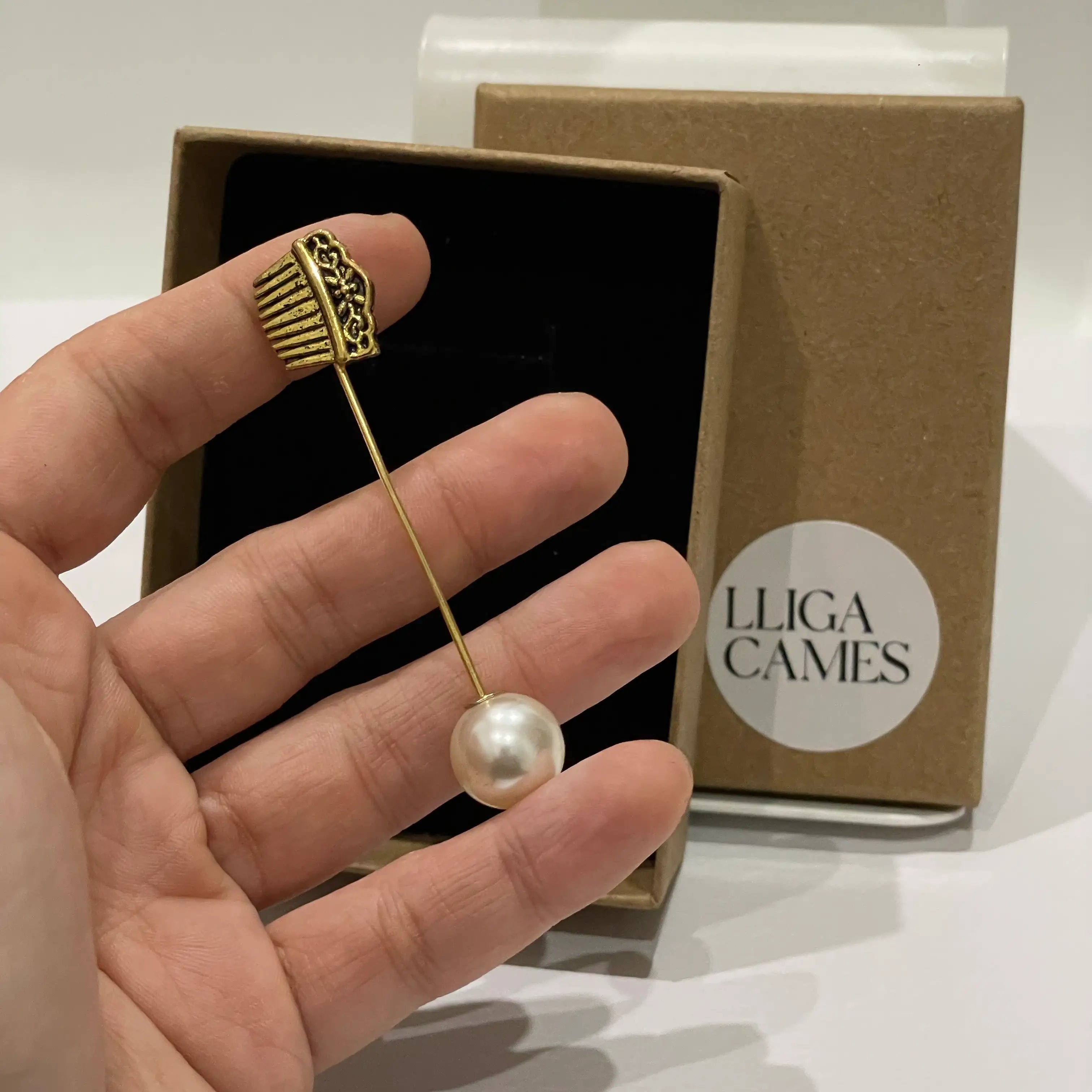 Aguja de banda Peineta dorada