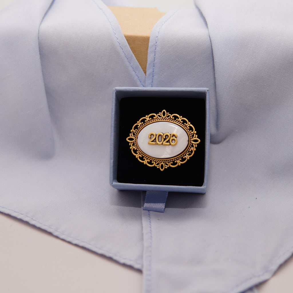 Pasador sujeta-pañuelo dorado ovalado 2026