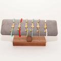 Pulsera de bolas con Virgen dorada – Varios colores