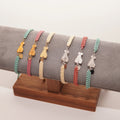 Pulsera de hilo trenzado con silueta de fallera – Varios colores